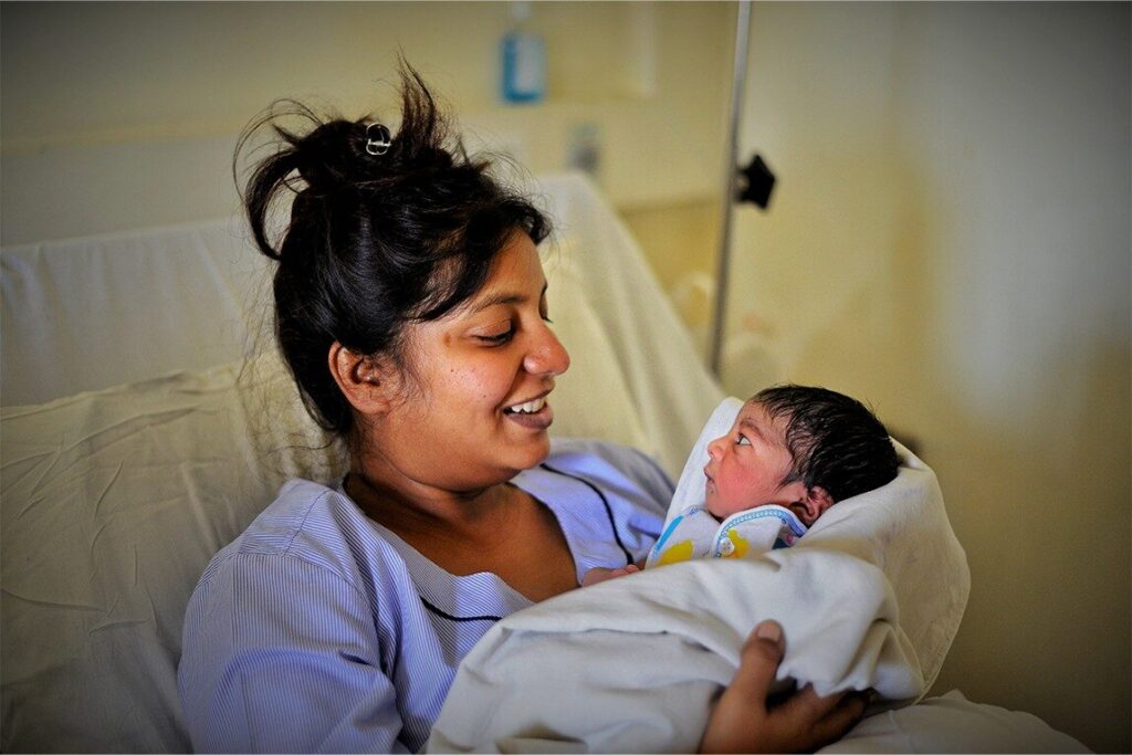 Yoga to support postpartum health 1 newborn and mother happy image
