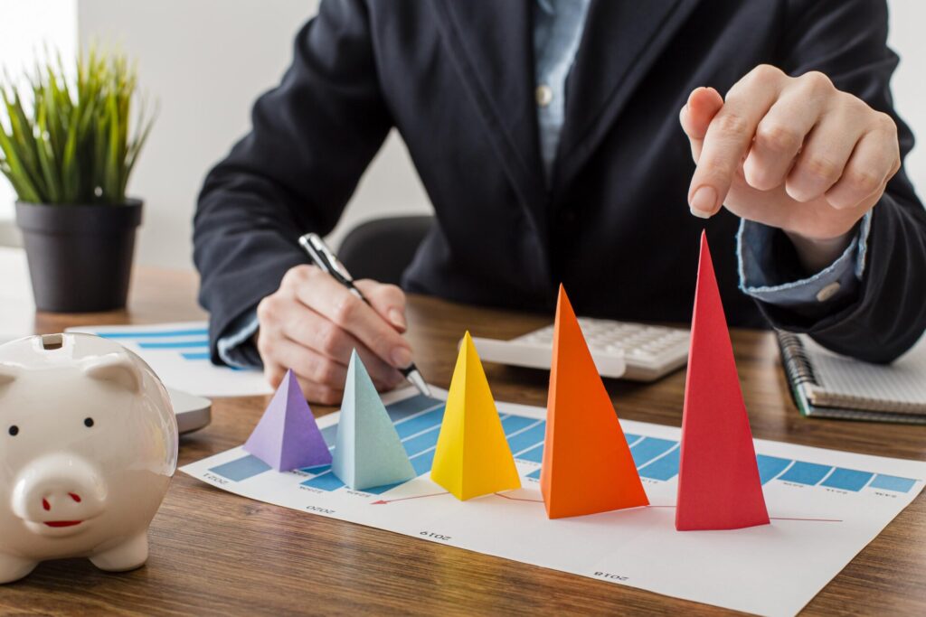 Learn How to Be Consistent in Life: 10 Easy Steps to Stay Consistent 1 front view businessman with colorful cones representing growth