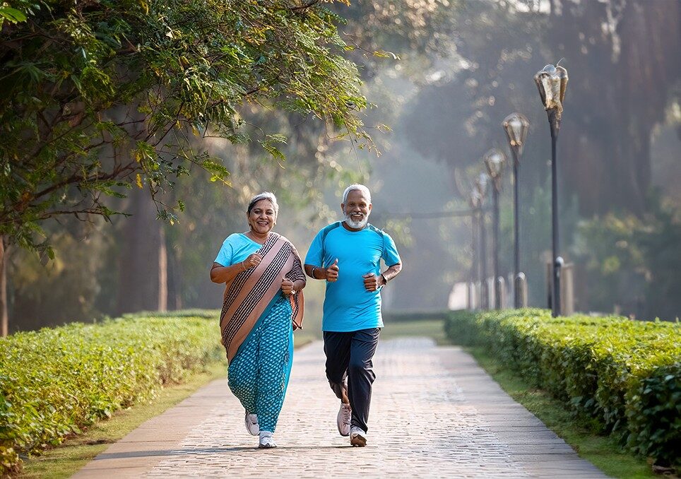 Yoga for longevity: An ancient way to graceful aging 1 old people walking with smile on their face in the park enjoying