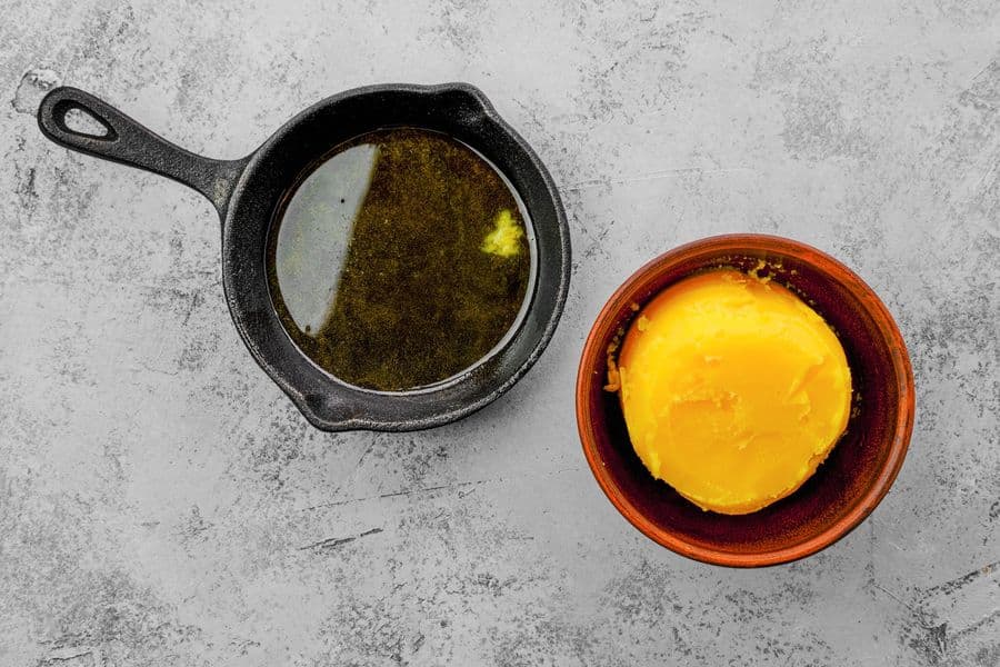 Clarified butter in a cast iron skillet and bowl