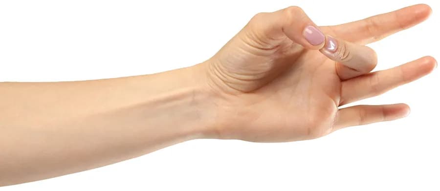 Female hand forming Shunya Mudra to relieve dizziness, vertigo, and ear discomfort