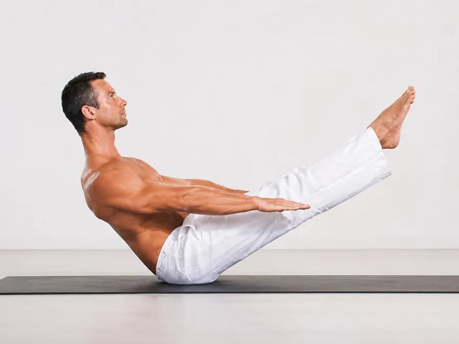Person practicing Vajroli Mudra in Siddhasana for pelvic floor and energy control