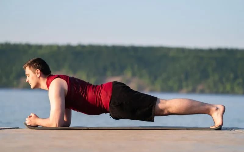 a young man practices yoga on the river bank 2026 03 24 07 48 30 utc 1