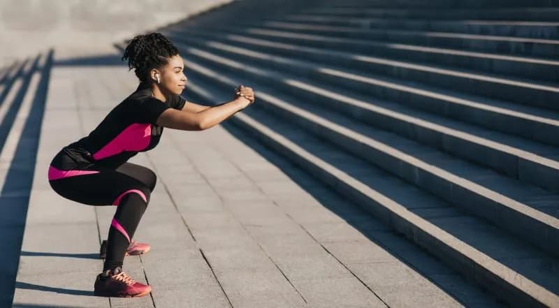 active-woman-exercising-outdoors-on-concrete-steps-2026-01-08-23-24-35-utc.jpg