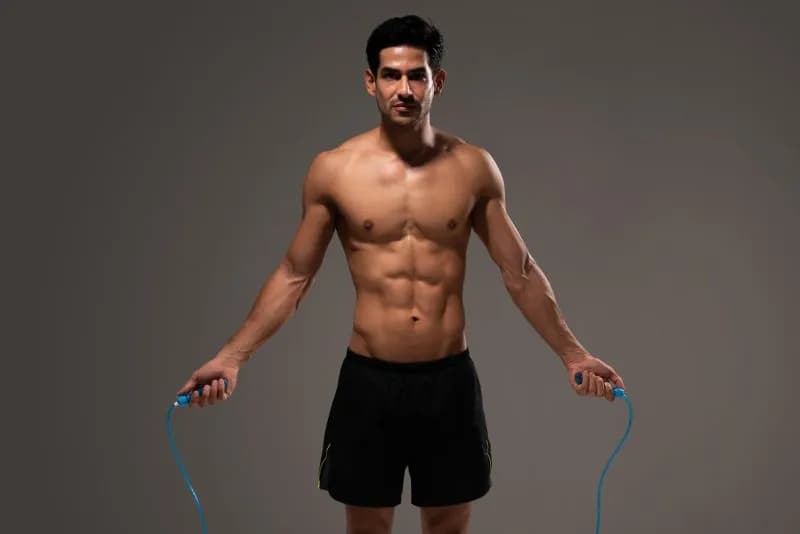 athletic-hispanic-male-skipping-rope-in-studio-2026-03-20-03-58-42-utc.jpg