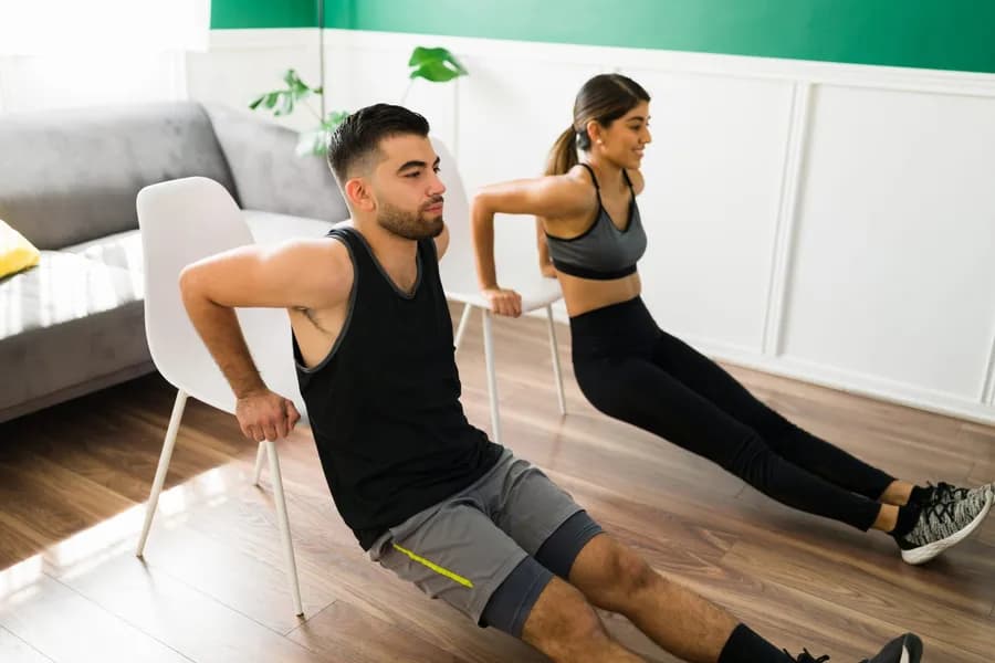 athletic man and woman exercising indoors with cha 2026 03 23 20 33 33 utc