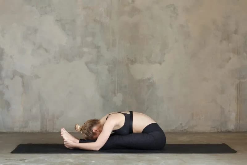 attractive young woman practices left seated forwa 2026 01 05 06 01 26 utc