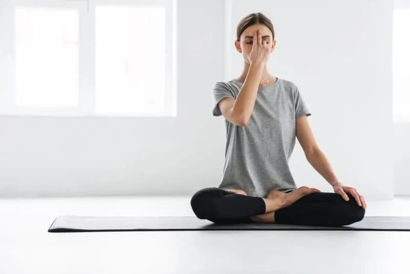 attractive young woman practicing meditation 2026 01 08 05 30 37 utc 1