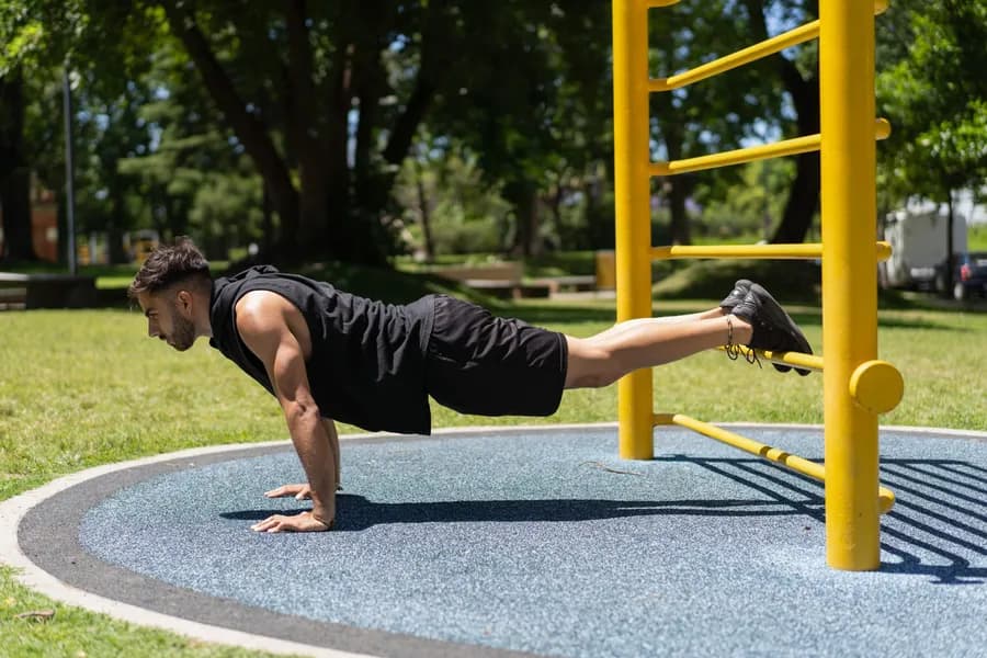 Young man doing push-ups as part of a beginner bodyweight workout