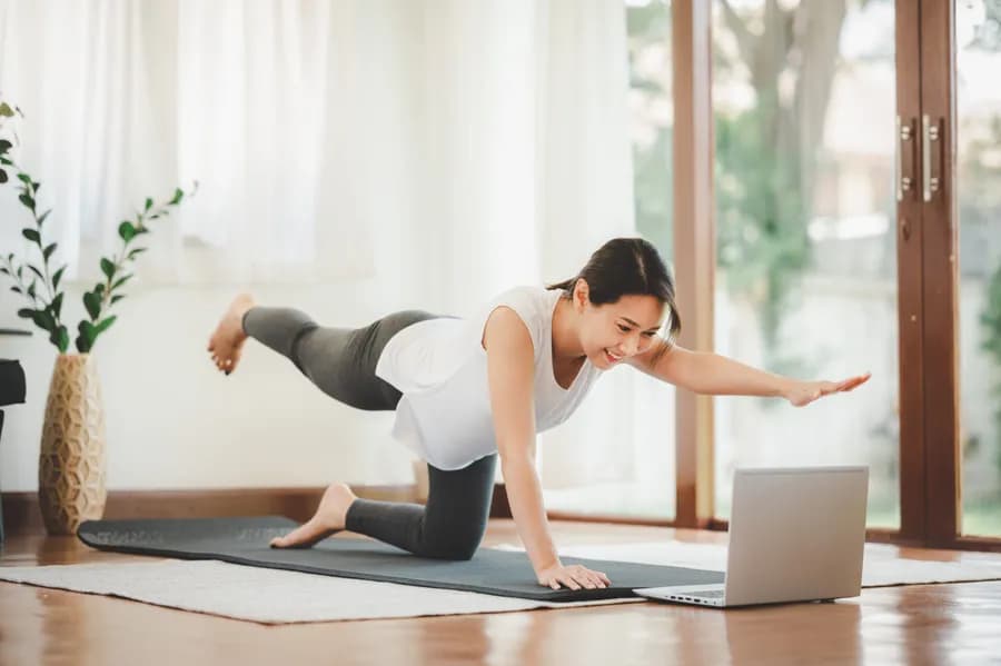 Woman doing a bodyweight home workout without equipment