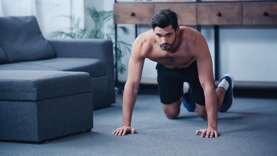 Man doing a push-up exercise at home on the floor