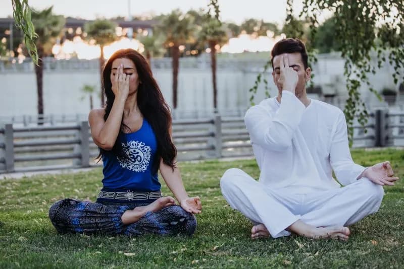 caucasian man and latin woman meditate in a park i 2026 01 06 09 41 08 utc
