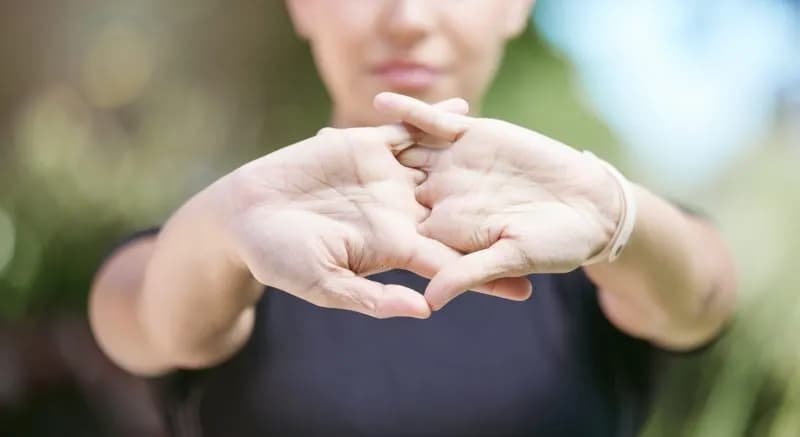 close up of female athlete interlocked hands while 2026 03 25 05 03 37 utc