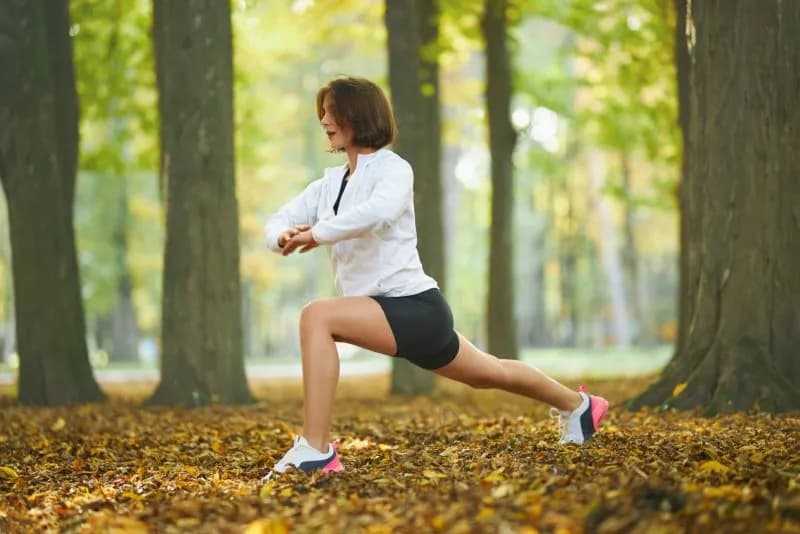 happy-female-in-sport-outfit-stretching-body-at-pa-2026-03-24-23-28-57-utc.jpg
