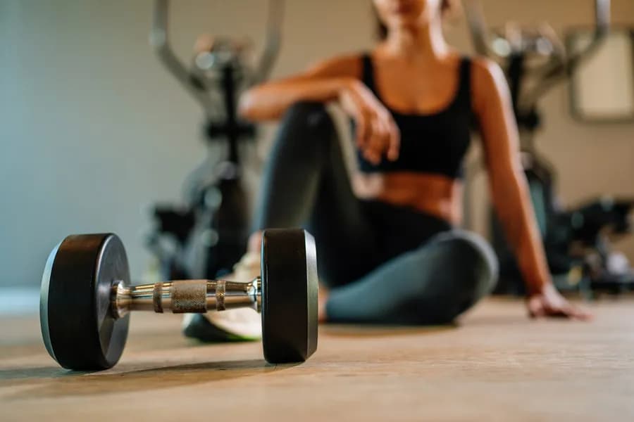 Sporty woman running on a treadmill during a strength and fitness workout