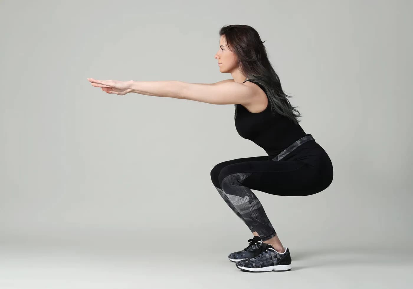 Person performing a squat workout