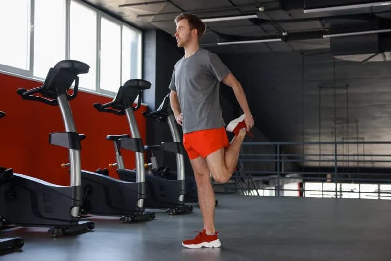 man-in-sportswear-stretching-in-gym-low-angle-vie-2026-05-14-16-16-17-utc.jpg