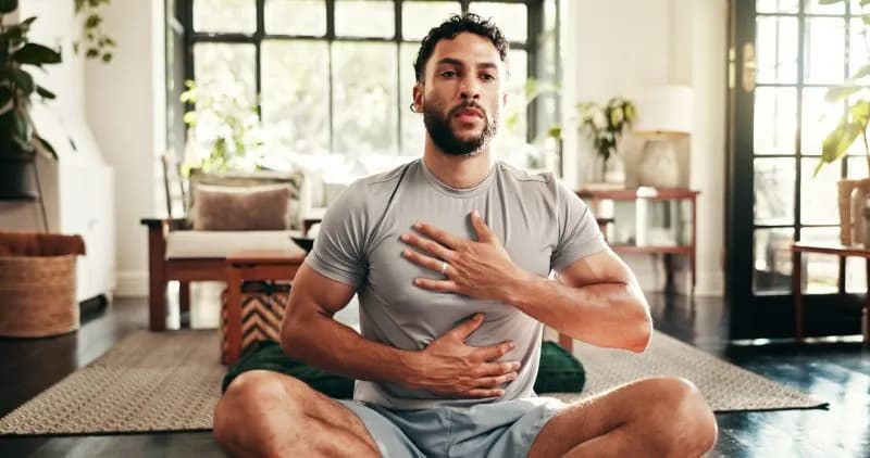 man meditating indoors cross legged on floor 2026 03 25 03 02 47 utc 2