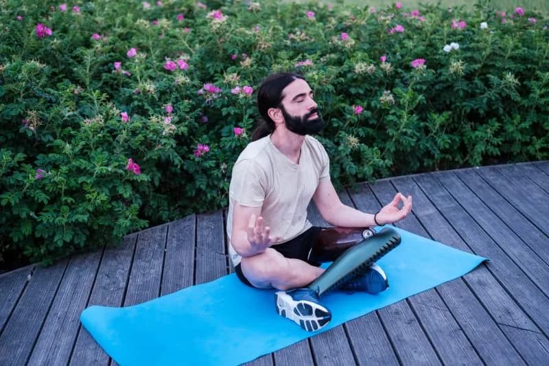 man meditating outdoors on yoga mat 2026 01 07 02 22 47 utc