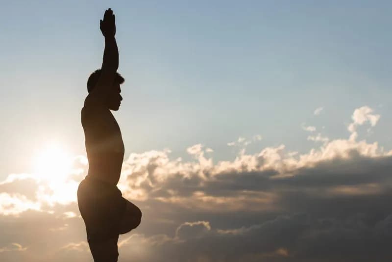 man practicing yoga asana at sunset 2026 03 25 01 11 27 utc