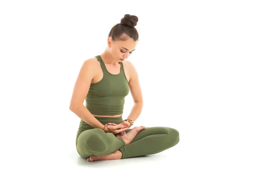 Practising Muladhara Chakra Mudra for root chakra grounding and stability