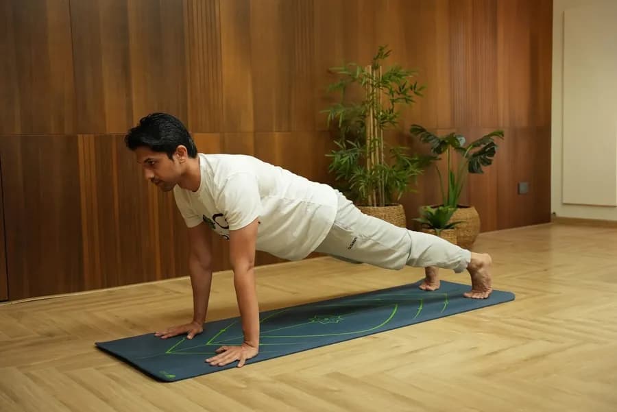 Person preparing for a seated forward fold stretch