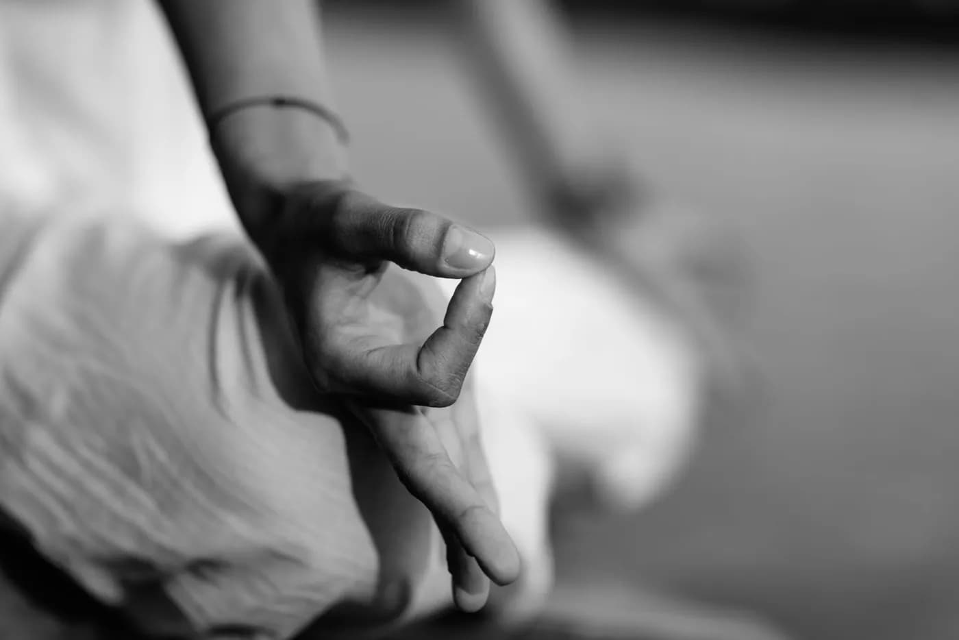 Hands forming Gyan Mudra to prepare for sleep