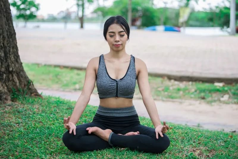 slim girl play yoga on the lawn at the park relax 2026 01 11 10 36 38 utc