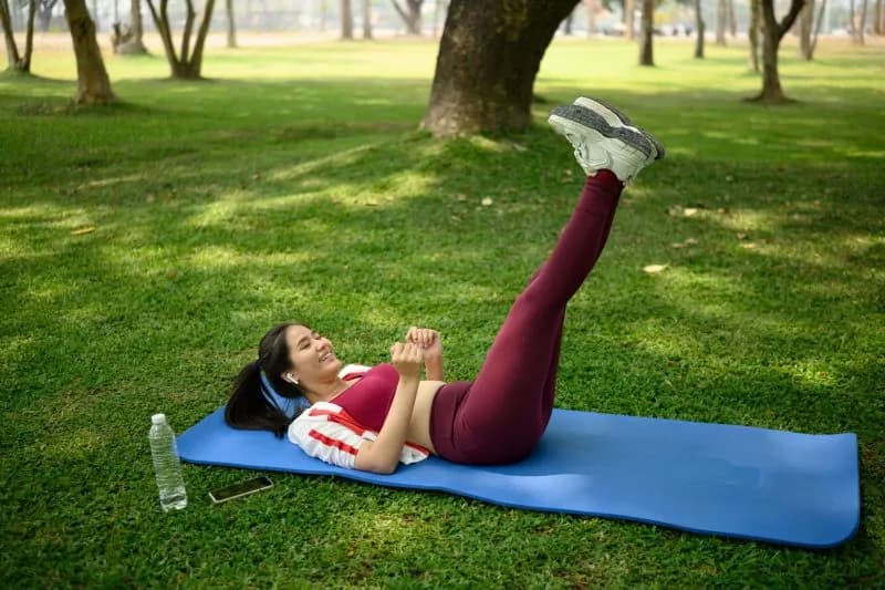 smiling-young-woman-exercises-outdoor-lifting-her-2026-01-09-10-54-03-utc-1.jpg