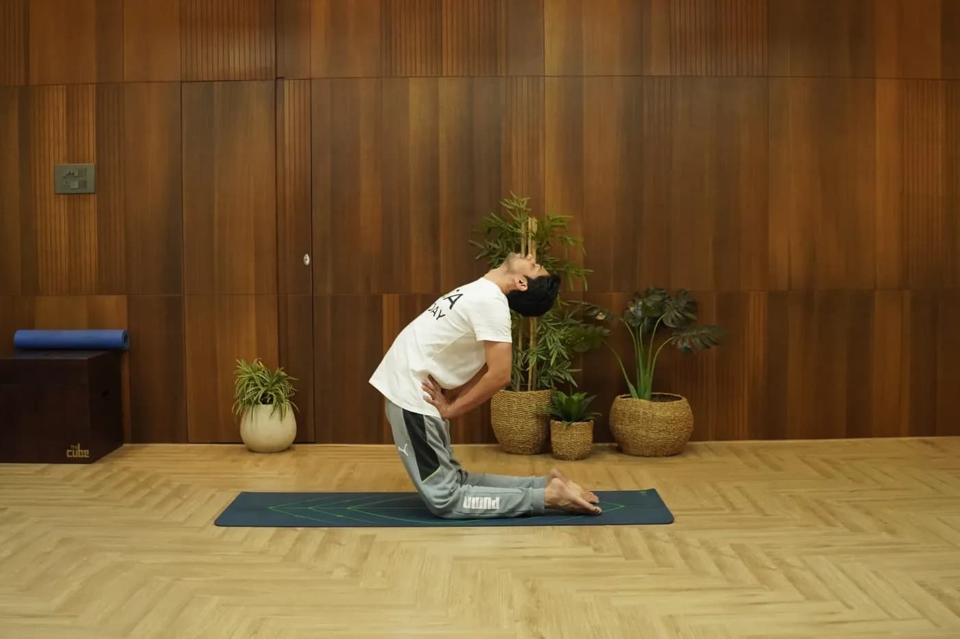 Person practicing Ustrasana camel pose backbend