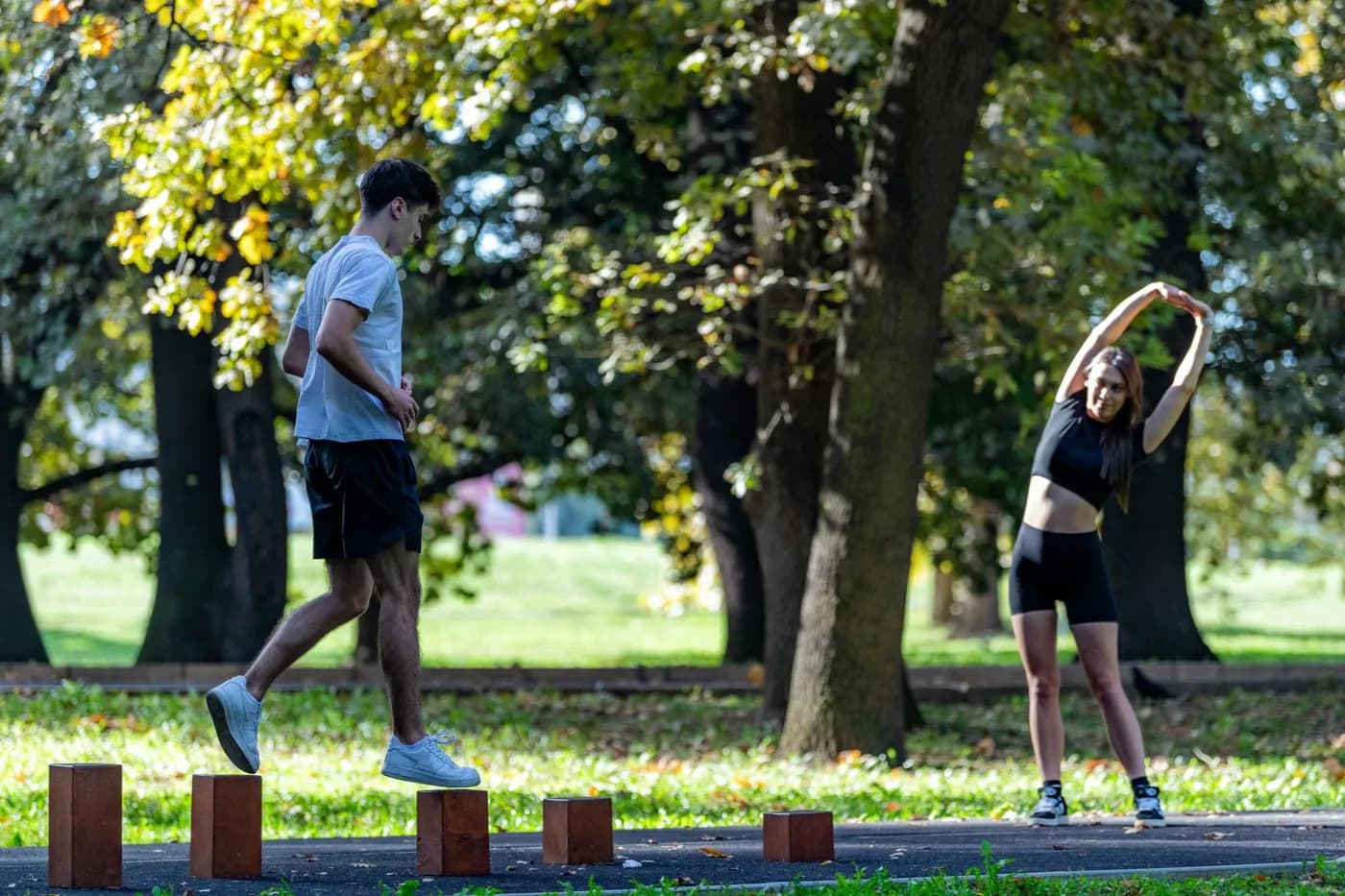 Couple warming up outdoors before a workout