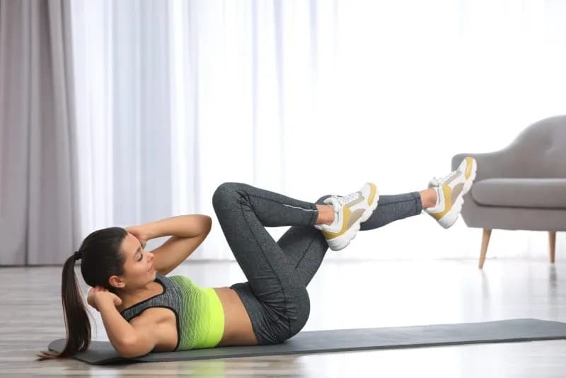 woman-doing-abdominal-crunches-on-exercise-mat-2026-03-05-11-30-01-utc.jpg