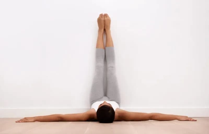 woman doing legs up the wall yoga pose 2026 03 25 03 20 55 utc 1
