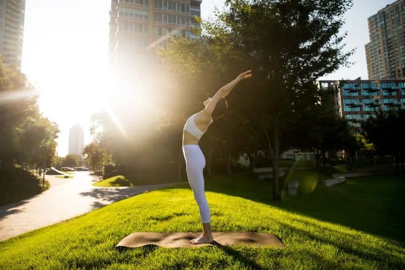 woman doing yoga in a park 2026 03 23 23 30 13 utc