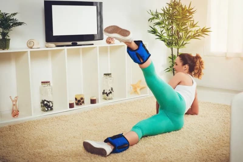 woman-exercising-at-home-with-ankle-weights-2026-01-05-06-23-35-utc.jpg