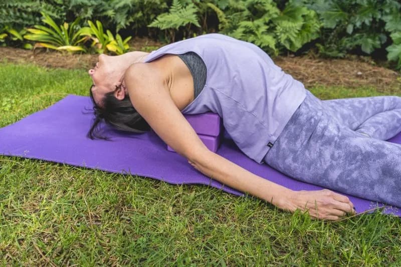 woman-lies-on-a-yoga-block-to-improving-posture-2026-03-24-07-07-26-utc.jpg