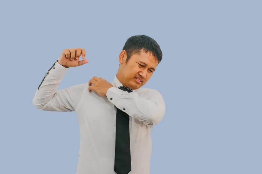 Man holding his shoulder in pain