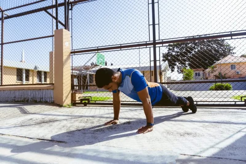 young-man-doing-pushups-on-outdoor-court-2026-03-17-20-18-27-utc.jpeg